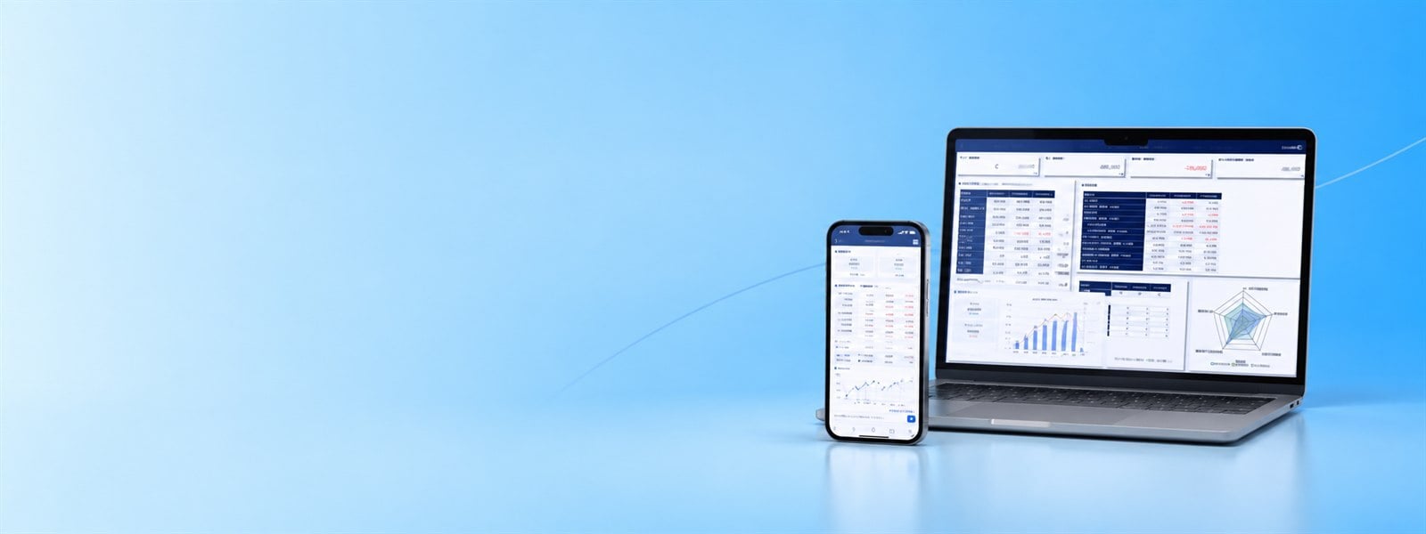 経営管理ダッシュボードを表示したパソコンとスマートフォン